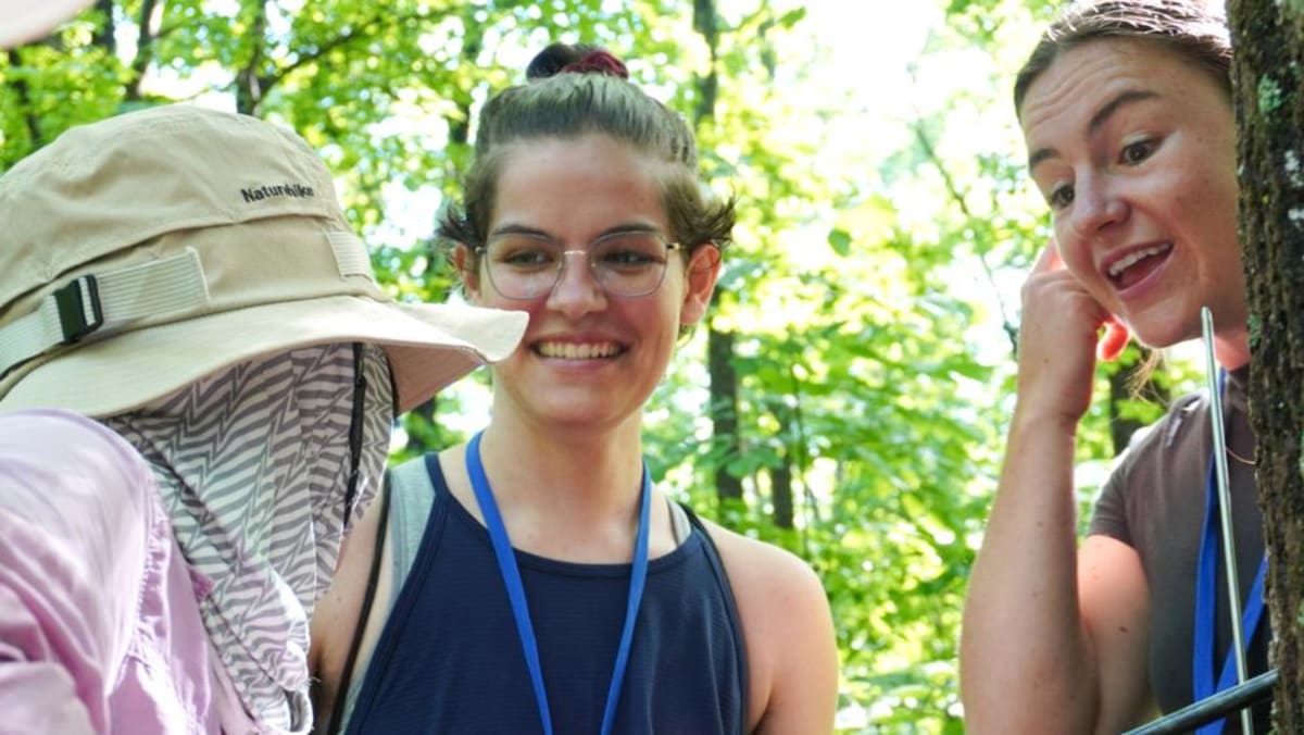 Graduate student Sierra Hill learning to take tree core samples during climate science training