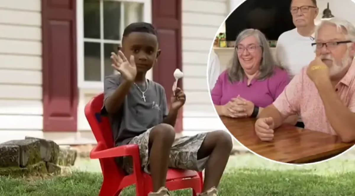 Young boy Roman Butzlaff smiling and waving outside his North Carolina home