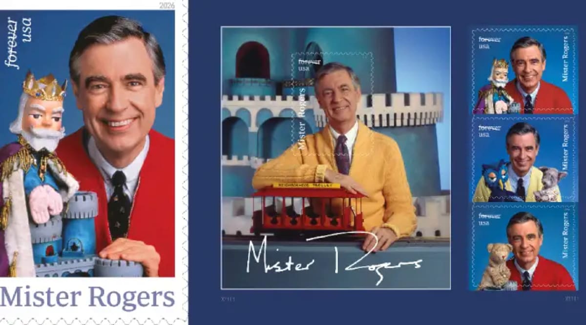 Forever stamp showing Fred Rogers in red cardigan sweater with King Friday XIII puppet