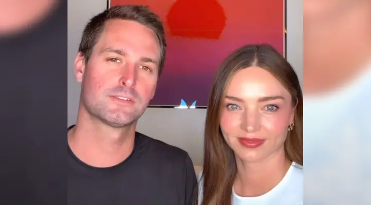 Evan Spiegel and Miranda Kerr smiling together, couple who erased medical debt for Californians