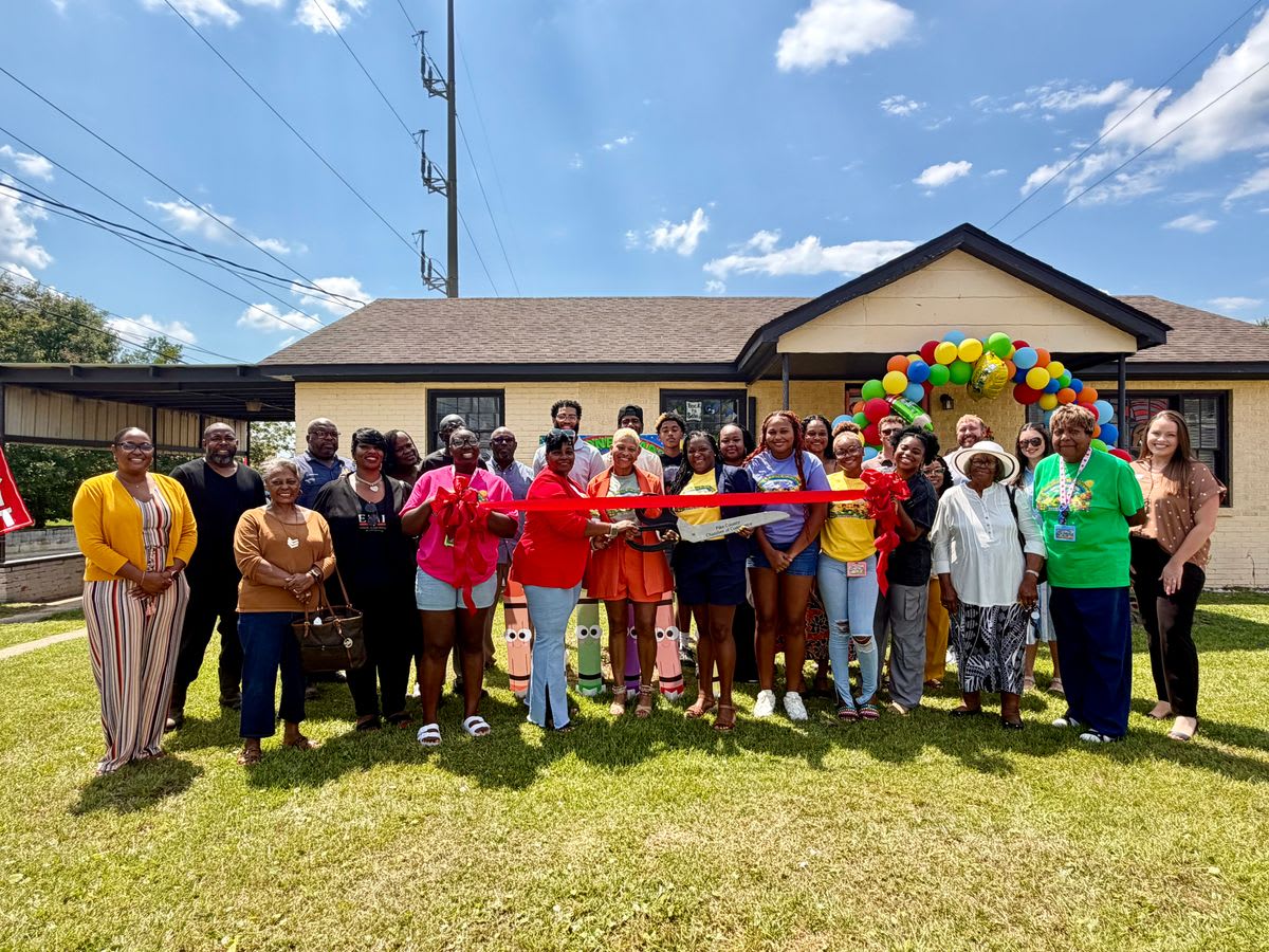 Sophia Austin cuts ribbon at Milestone Academy grand opening with Chamber of Commerce members