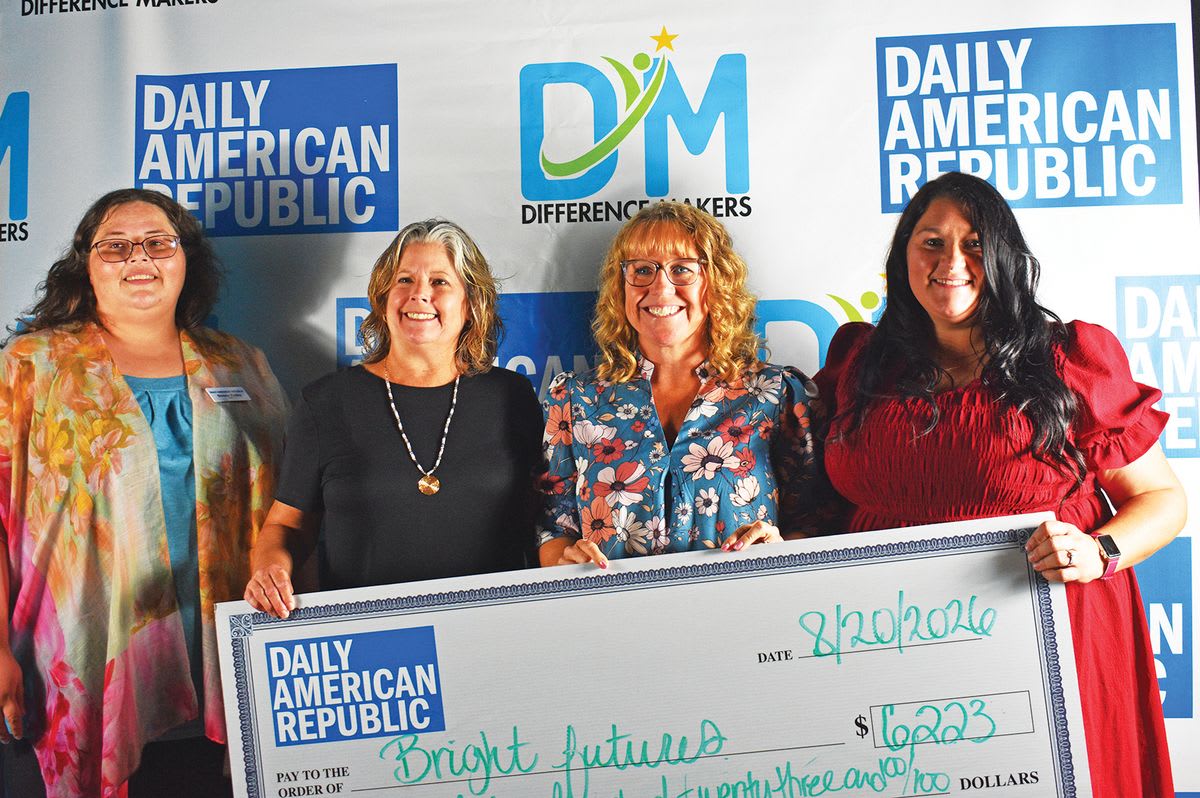 Four women holding oversized check for $6,225 at Difference Makers donation event in Poplar Bluff
