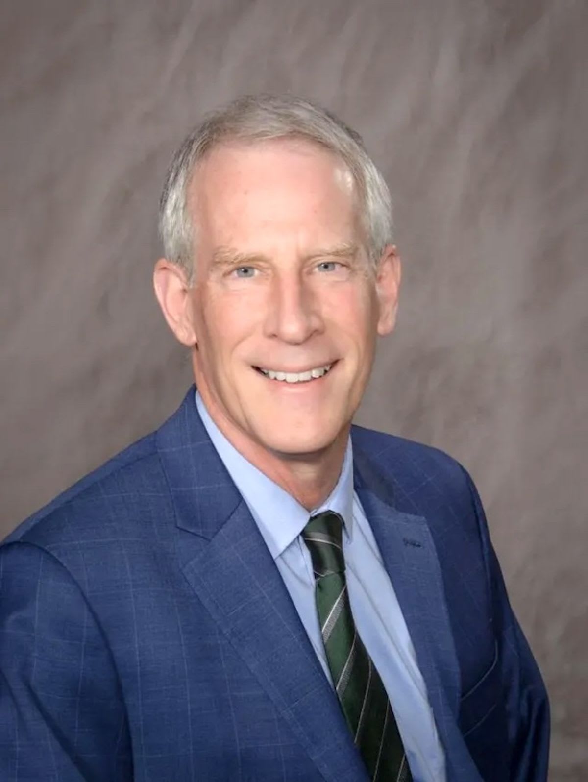 North Carolina renewable energy infrastructure with solar panels and wind turbines against blue sky