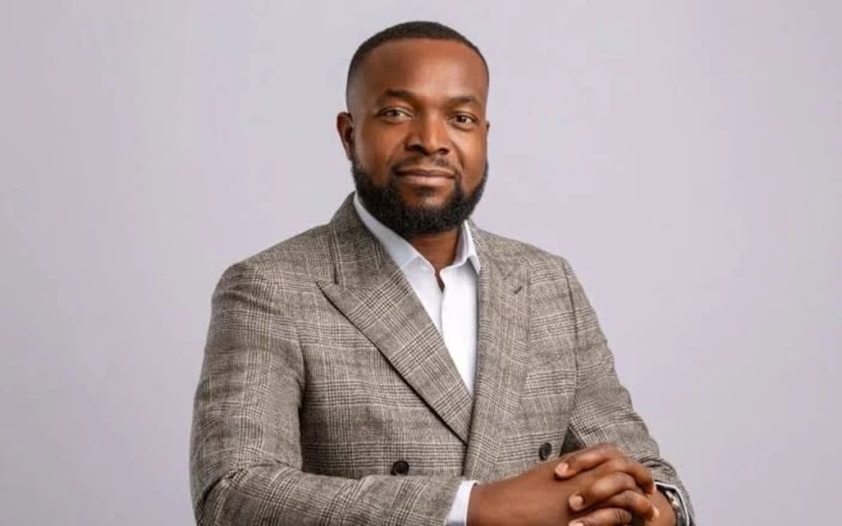 Nigerian tech students collaborating on laptops in bright modern training facility