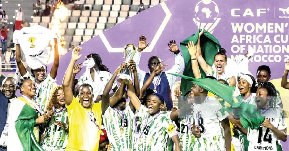 Nigeria Super Falcons midfielder Toni Payne celebrating with teammates in green jerseys