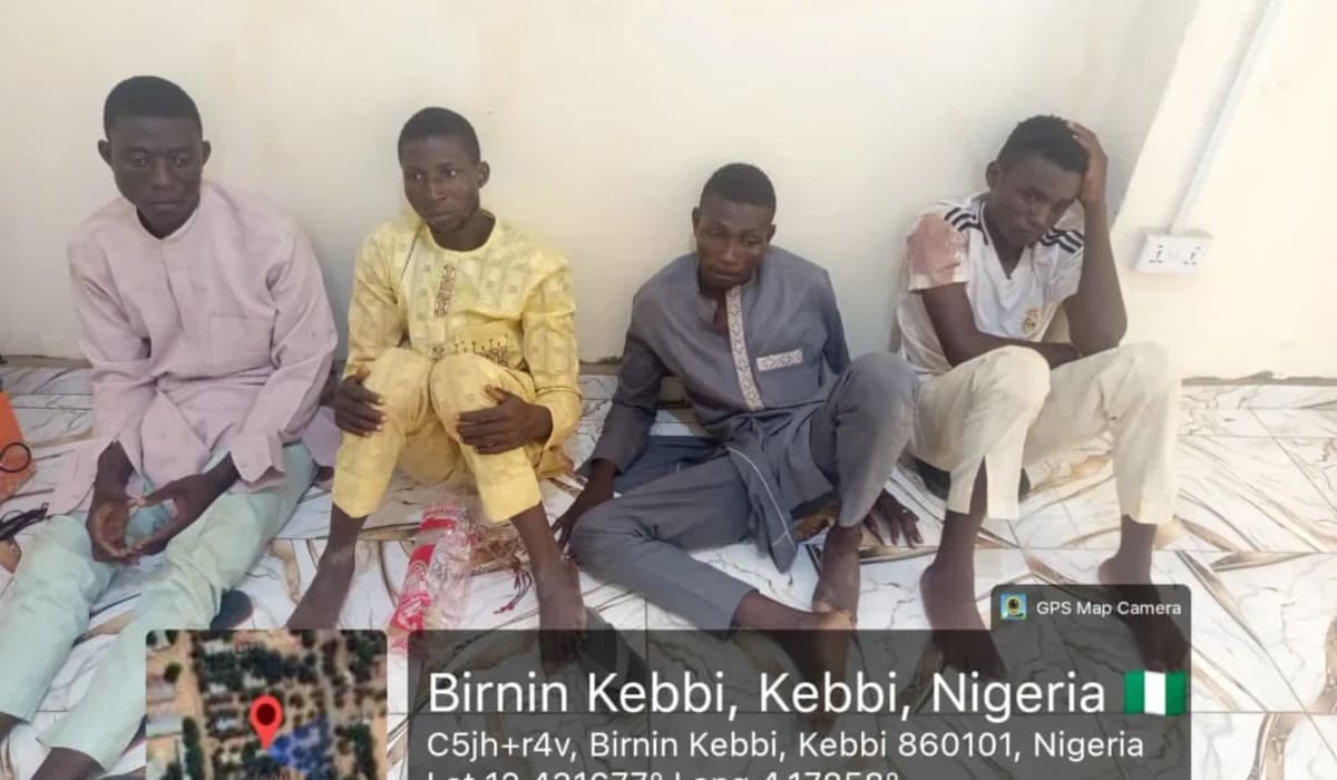 Nigerian soldiers standing with rescued kidnapping victims after successful military operation