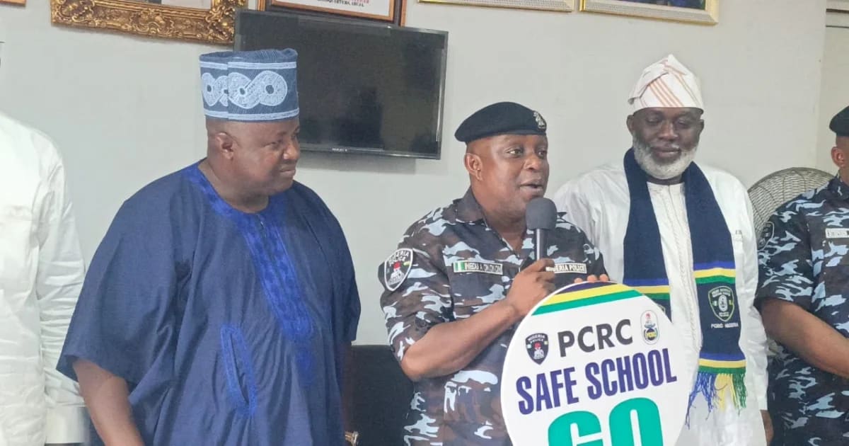 ** Nigerian community volunteers and police officials meeting to discuss school safety protection programs
