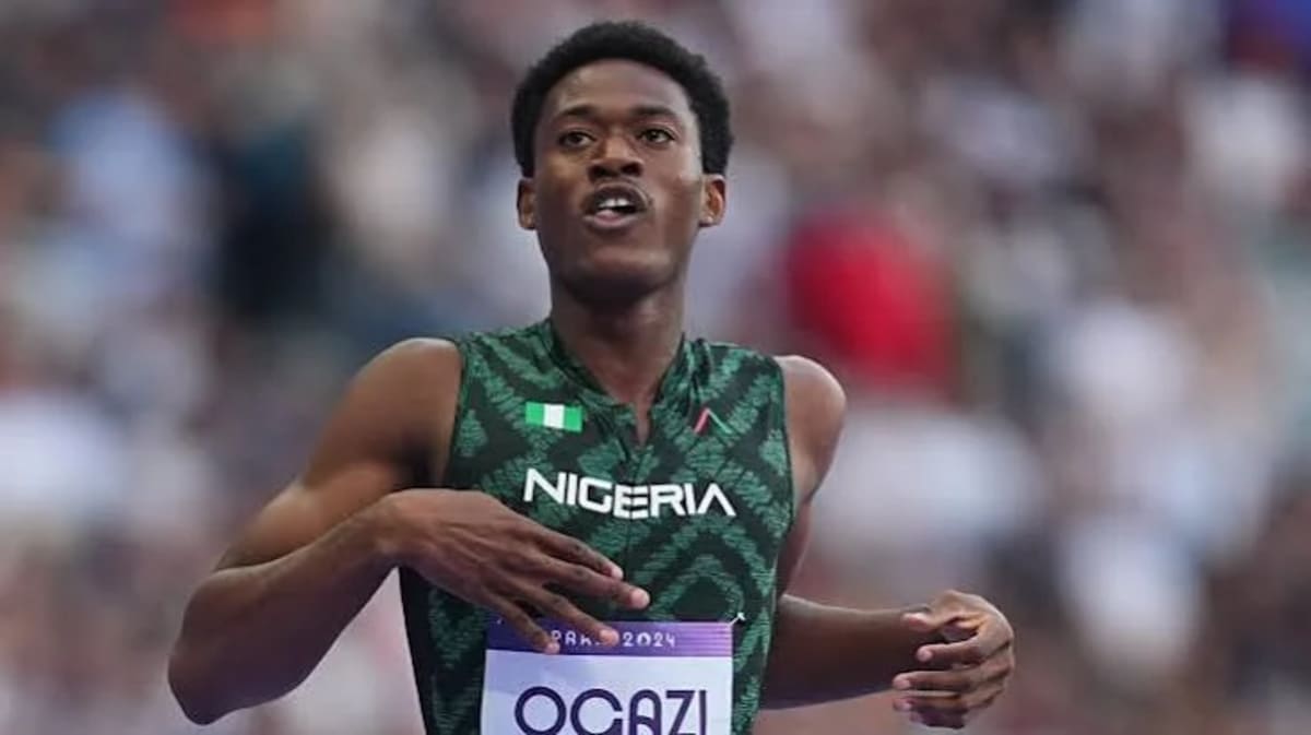 Samuel Ogazi celebrating after winning gold medal in 400 meter race at Glasgow Commonwealth Games