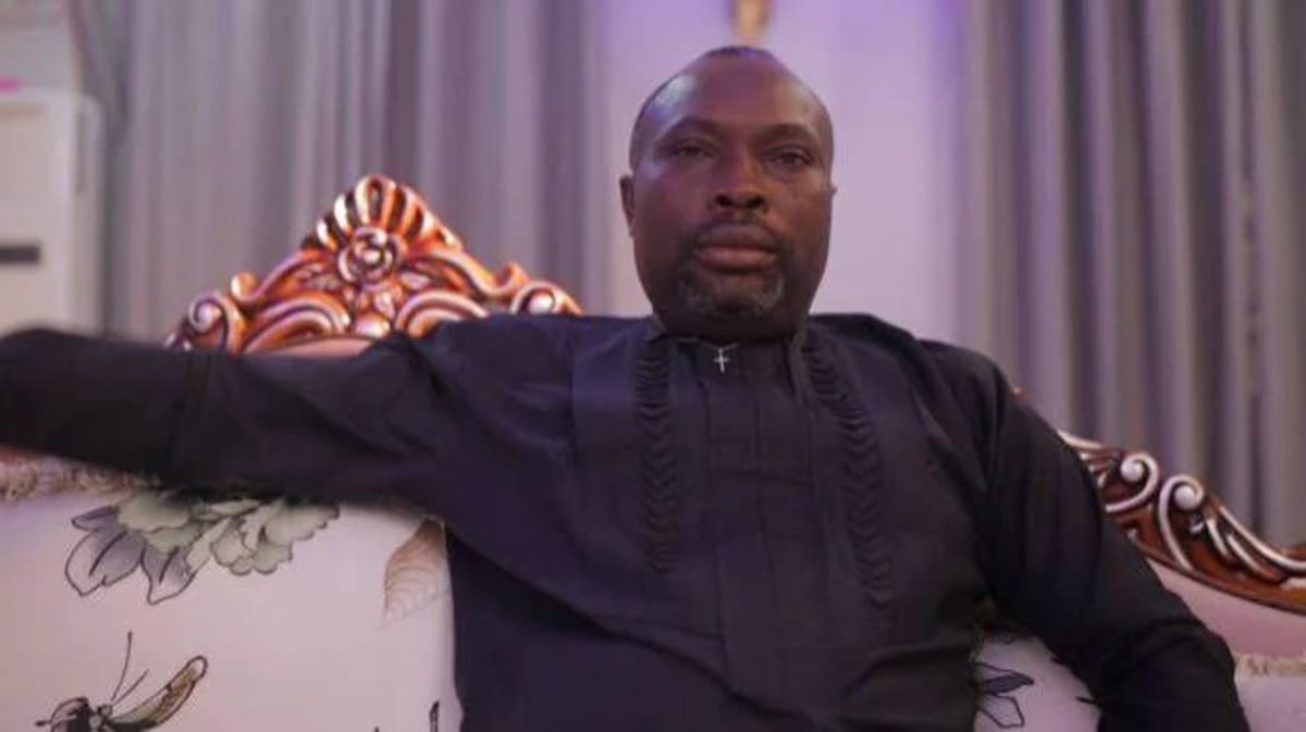 Nigerian barber Suleyman receiving surprise gift from businessman Daniel Omoyibo in barbershop