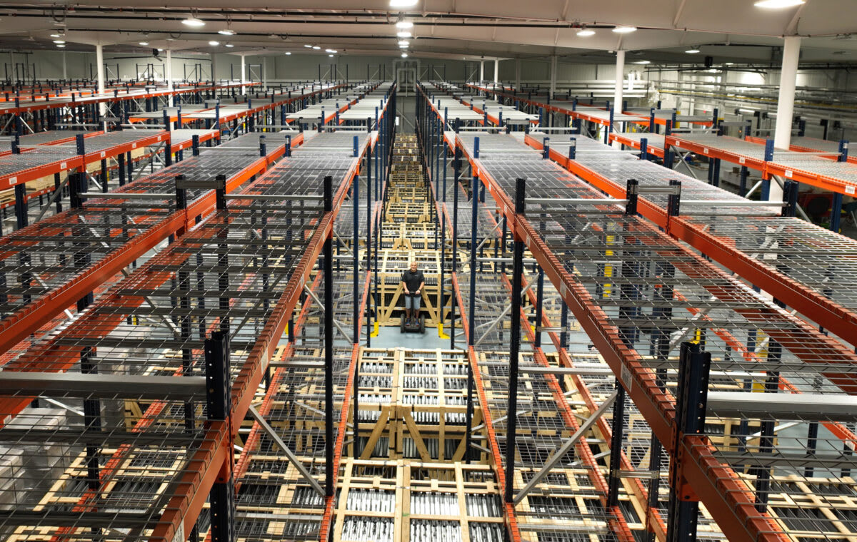 Modern clean energy manufacturing facility in Tennessee with solar panels and advanced equipment