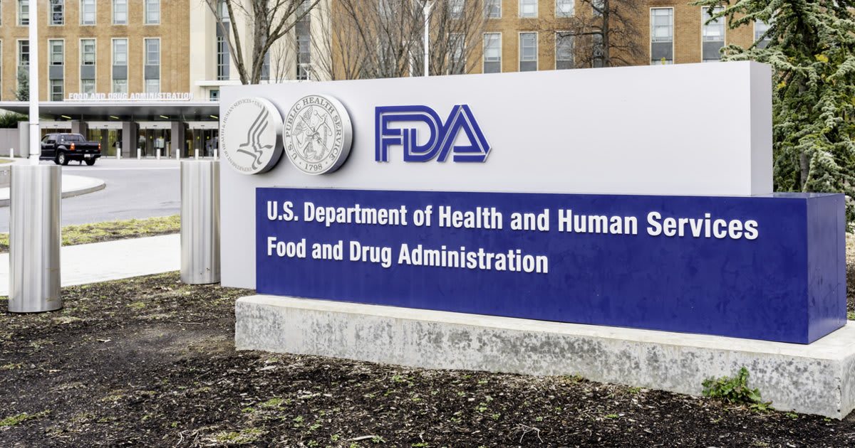 Radiologist reviewing chest X-ray images on computer screen with AI assistance technology