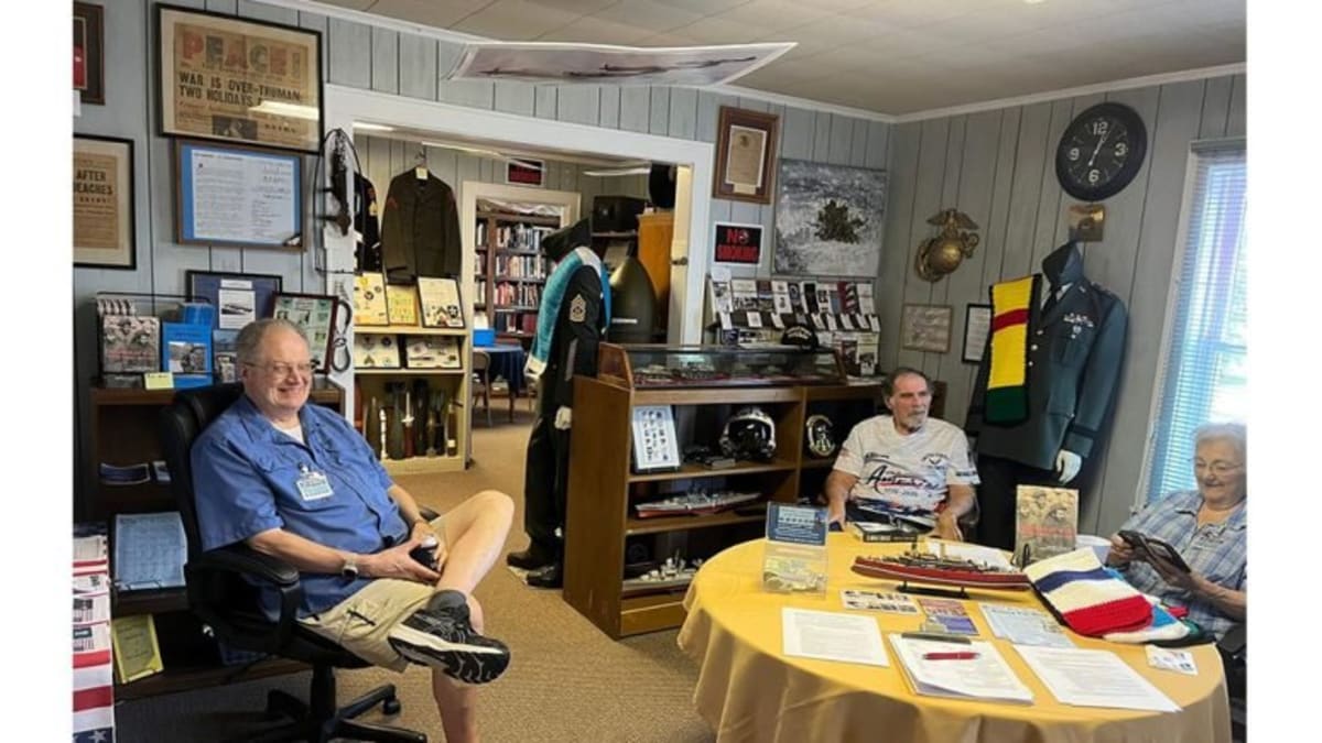 Volunteers and visitors gathered at Clay Township Military Library sharing veteran stories and writing thank-you cards