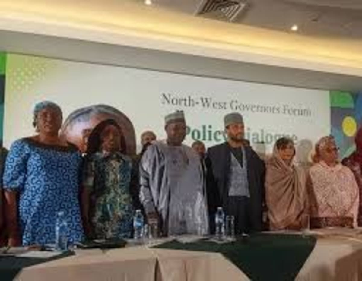 Nigerian government officials and international partners meeting in conference room in Kano discussing child welfare programs