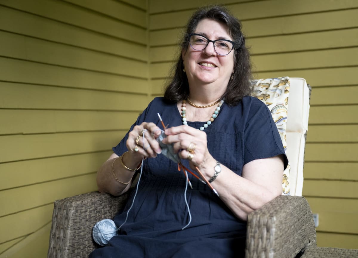 Marthe Young knitting a soft cotton breast prosthetic at her Easthampton home