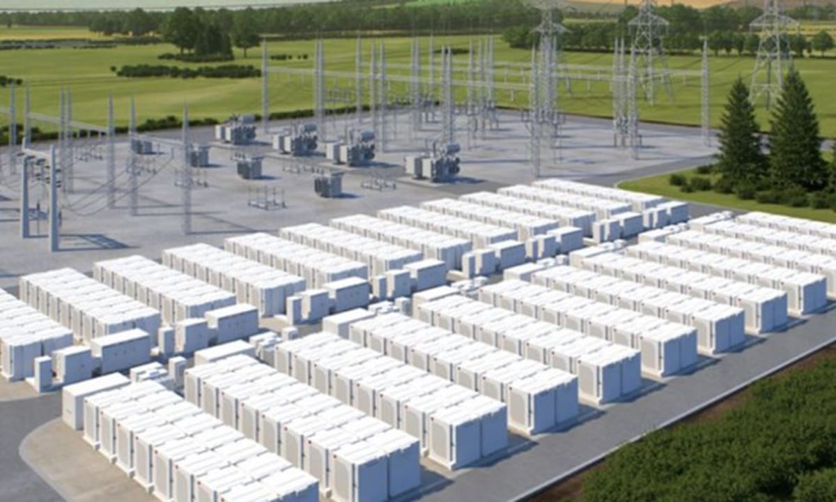 Large scale battery storage facility with rows of white storage containers under blue sky