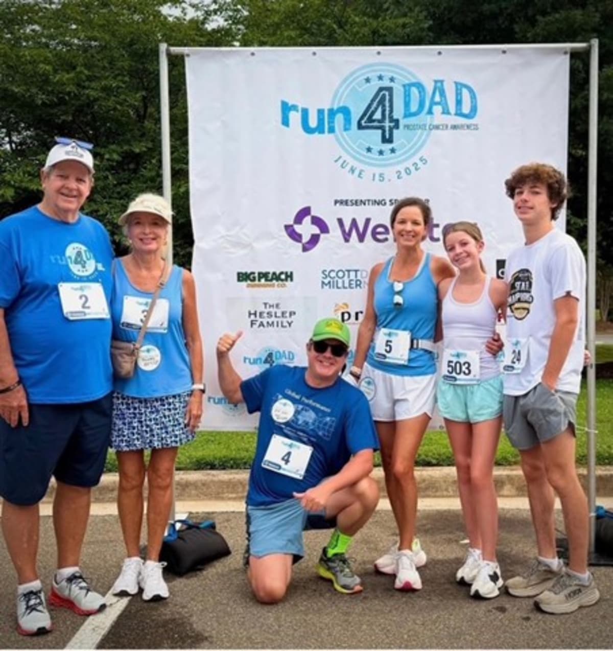Three generations of the Heslep family standing together at run4DAD prostate cancer awareness event