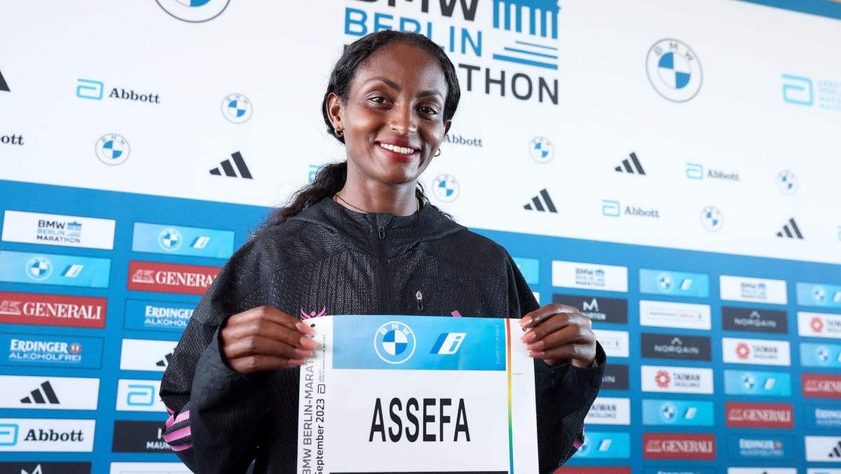 Ethiopian runner Tigst Assefa competing in a marathon race on city streets