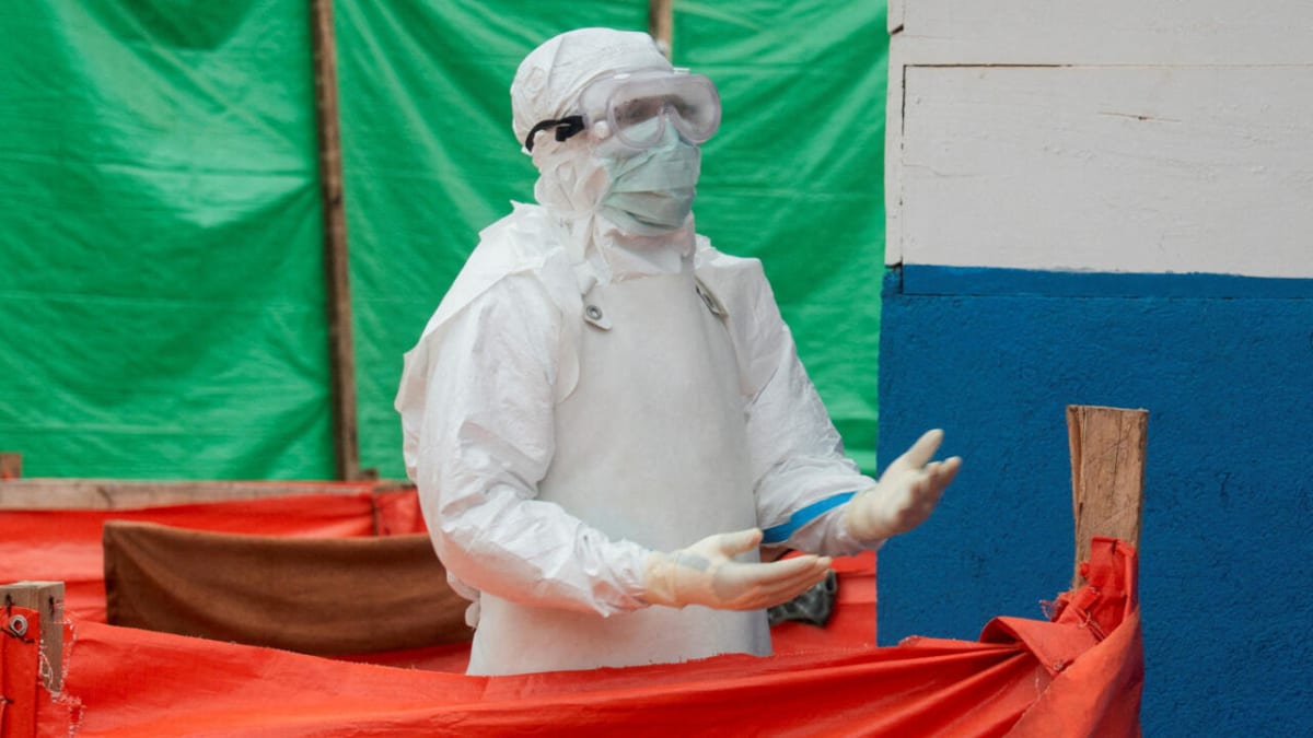 Healthcare worker in protective equipment at Ebola treatment center in DR Congo