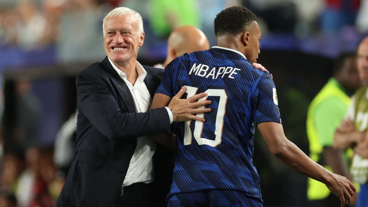 Mbappé Scores Twice as France Advances Through Storm Delay