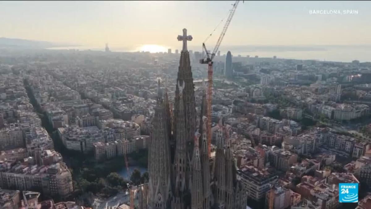 ** Sagrada Familia basilica in Barcelona with ornate spires reaching skyward and intricate stone carvings