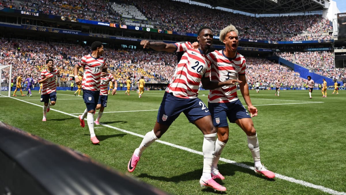 American soccer players celebrate after qualifying for World Cup knockout rounds in Seattle