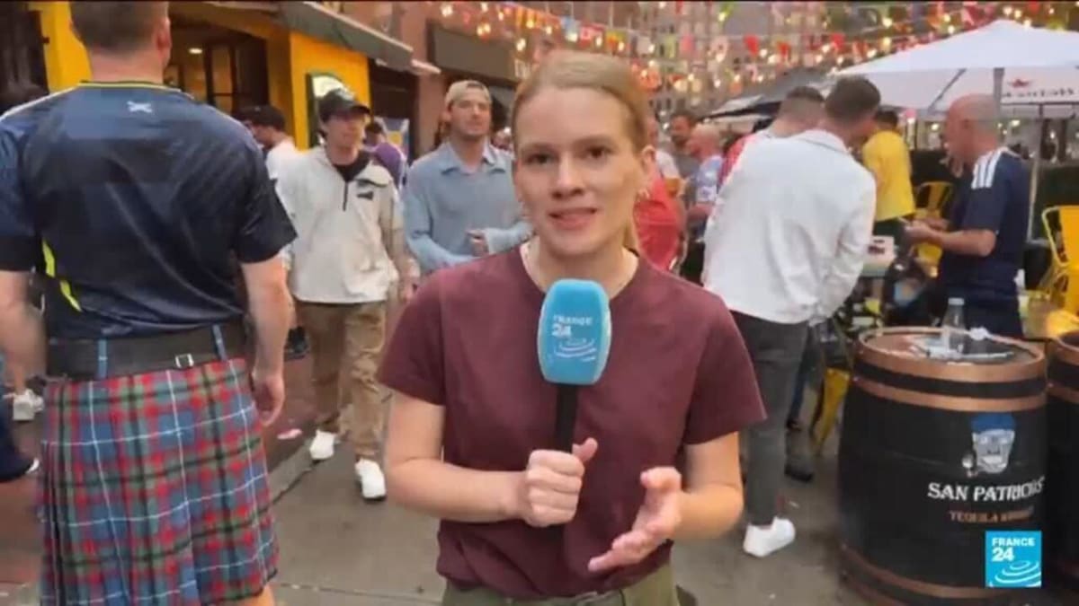 Scottish football fans in traditional tartan celebrating in Boston streets before World Cup match