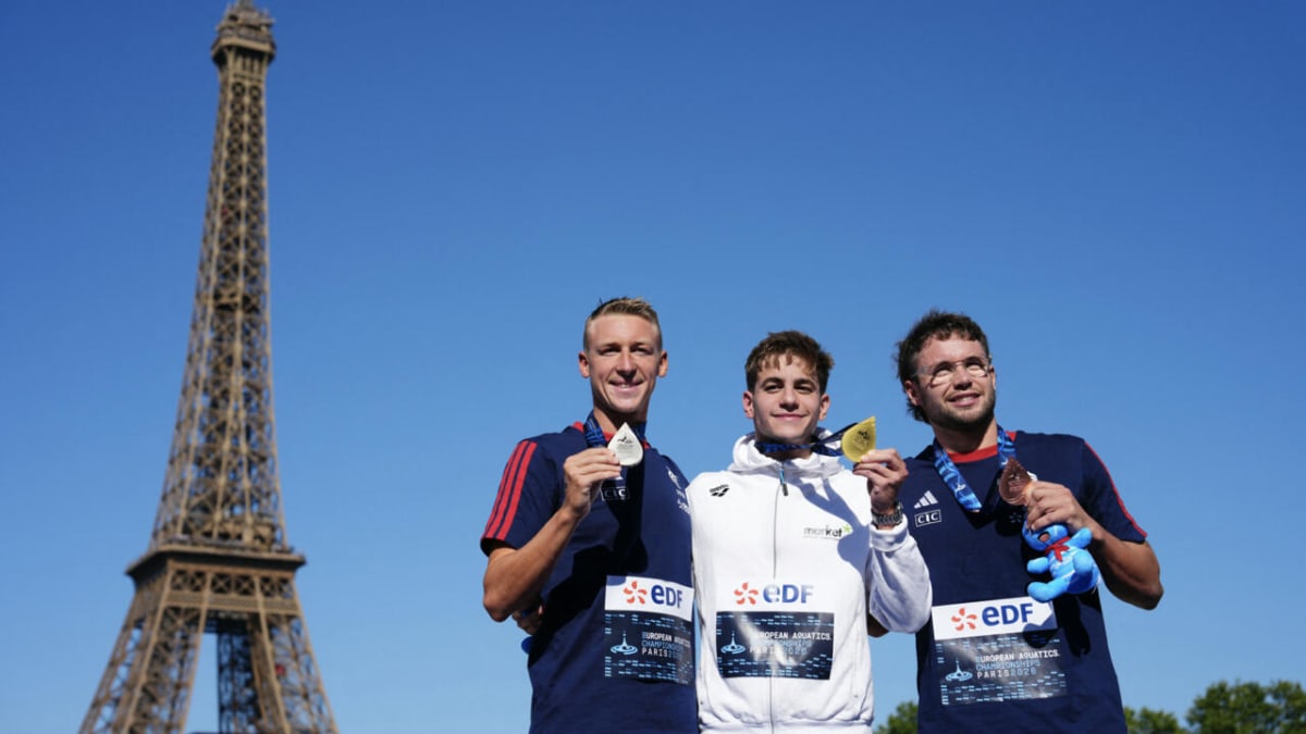 French swimmers Marc-Antoine Olivier and Logan Fontaine celebrating their European Championship medals in open water swimming