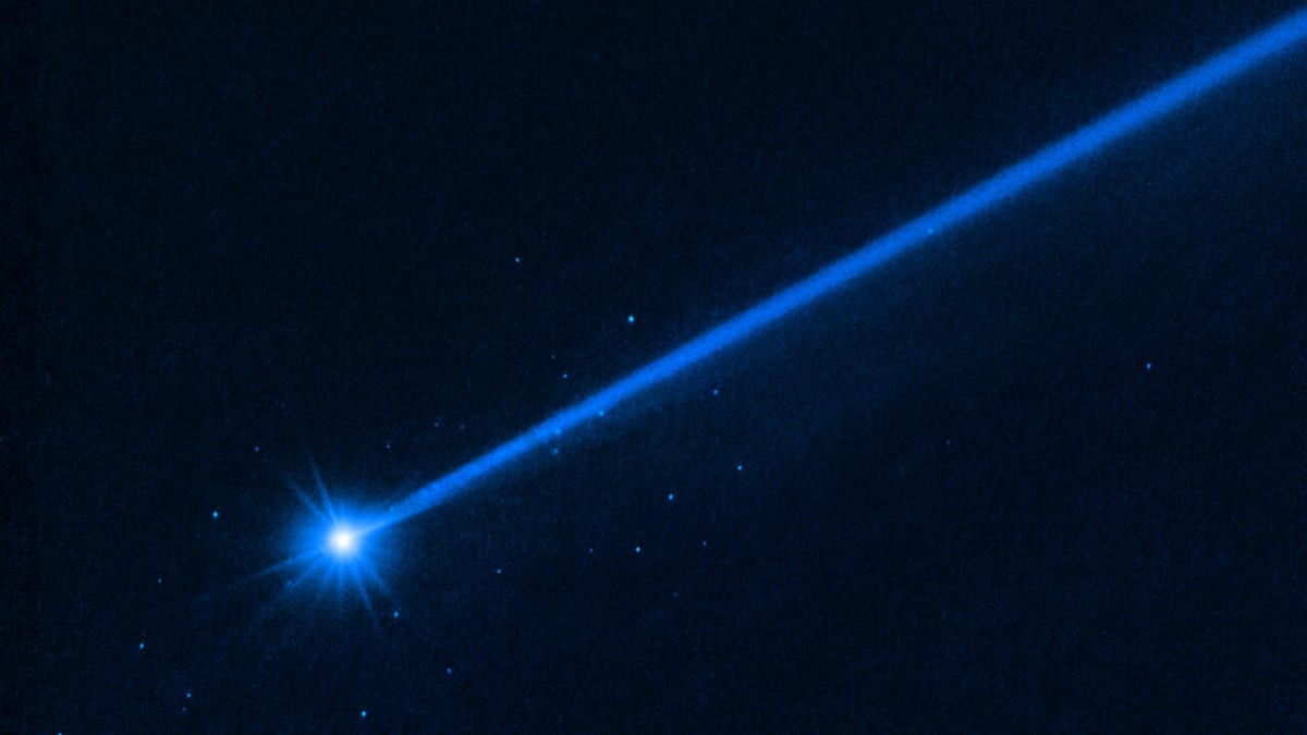 NASA spacecraft moments before impact with rocky, boulder-covered asteroid Dimorphos in space