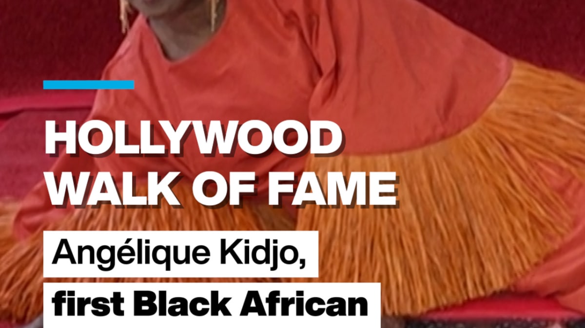 Angélique Kidjo smiling beside her star on the Hollywood Walk of Fame