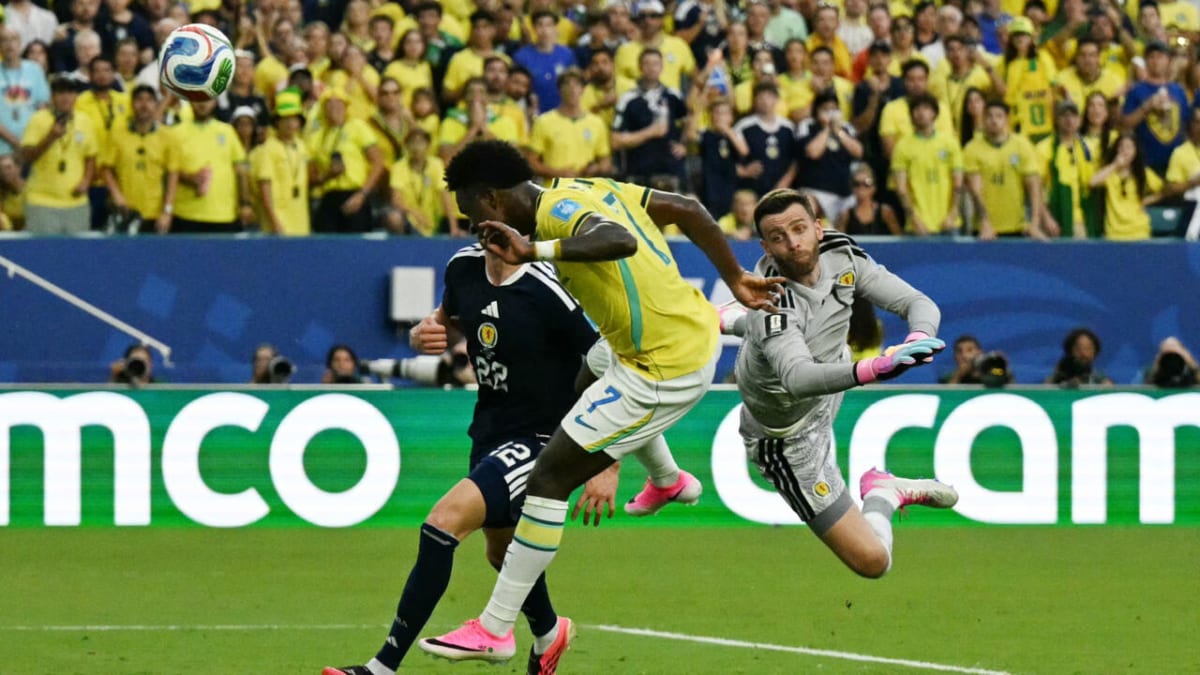 Vinicius Junior in Brazil's yellow jersey celebrating his goal against Scotland at World Cup