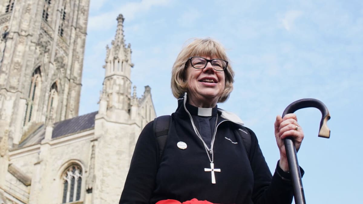 Archbishop Sarah Mullally in ceremonial robes smiling during her historic Canterbury Cathedral enthronement ceremony