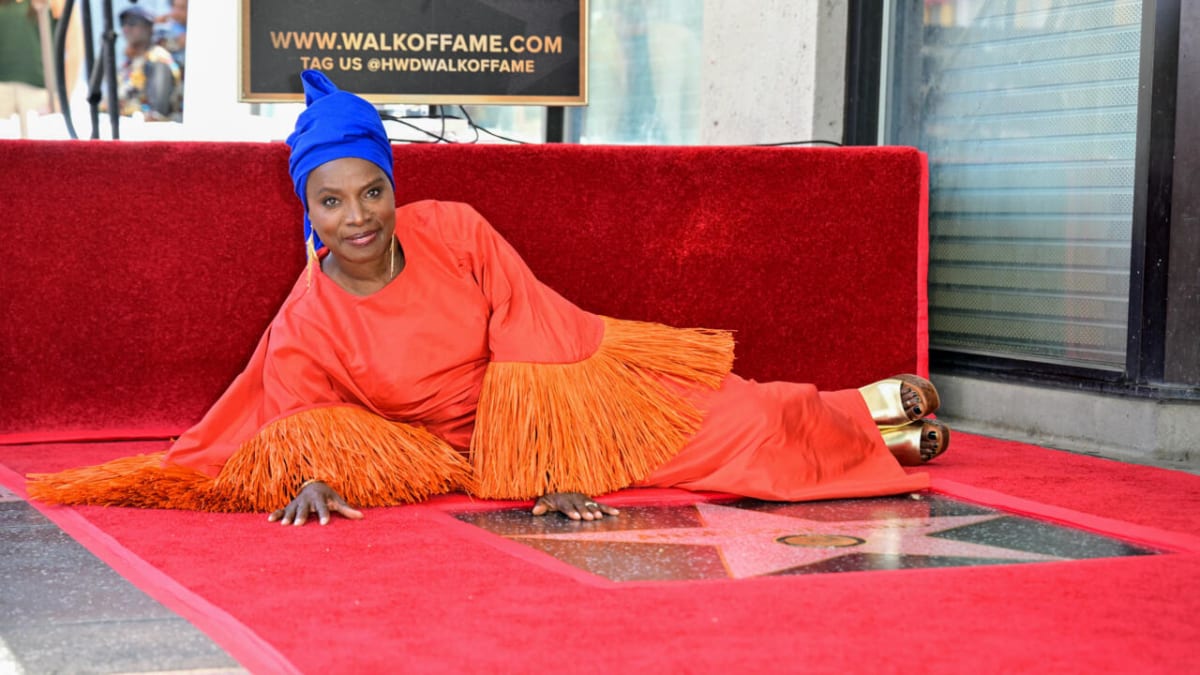 Angelique Kidjo smiling at her Hollywood Walk of Fame star unveiling ceremony in California
