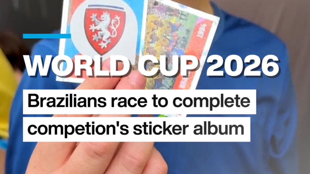 Brazilian families gathered together trading colorful World Cup sticker album cards