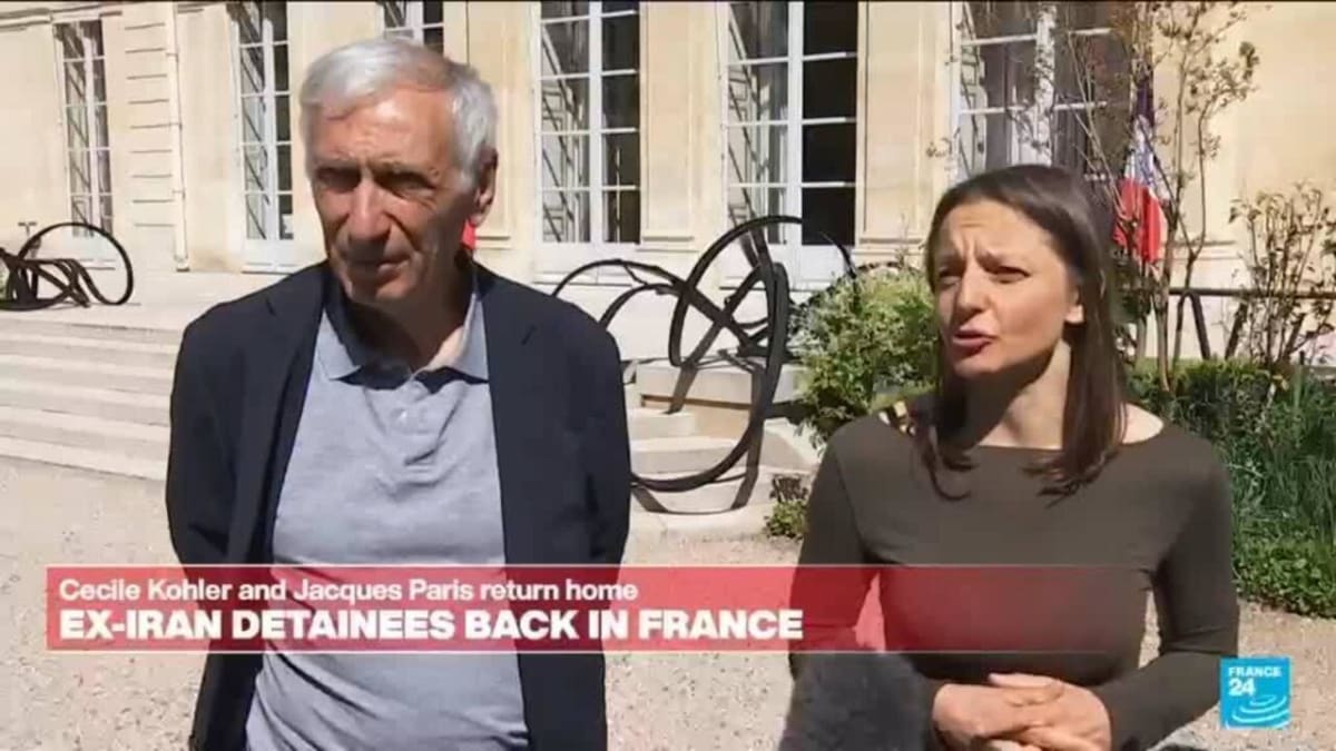 ** Two French citizens reuniting with officials at the Elysee Palace after Iranian detention