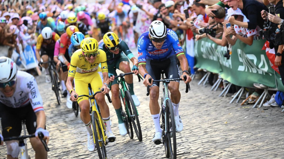 Mathieu van der Poel and Tadej Pogacar cycling through Paris during Tour de France final stage
