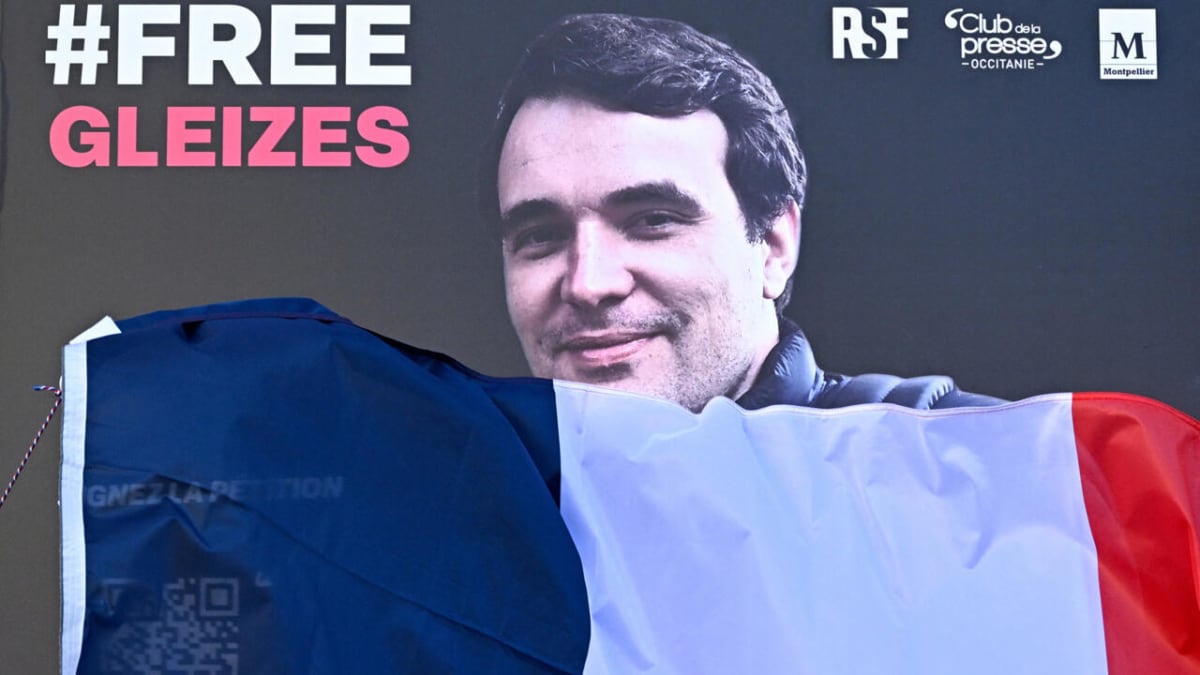 Portrait of French journalist Christophe Gleizes displayed at a press freedom demonstration in France