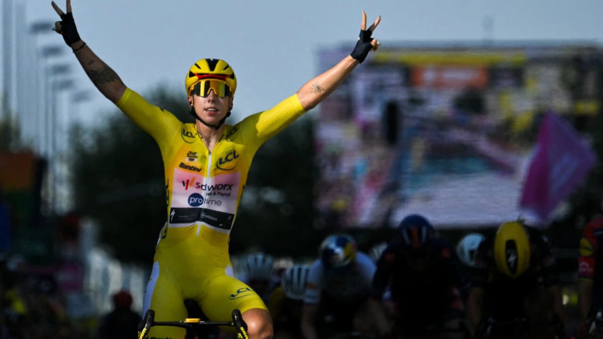 Dutch cyclist Lorena Wiebes in yellow jersey celebrating stage win at Tour de France Femmes finish line