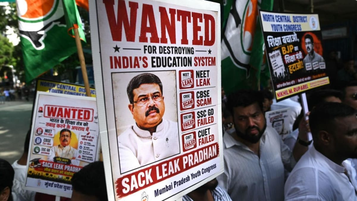 Young protesters celebrating in New Delhi after education minister resignation announcement