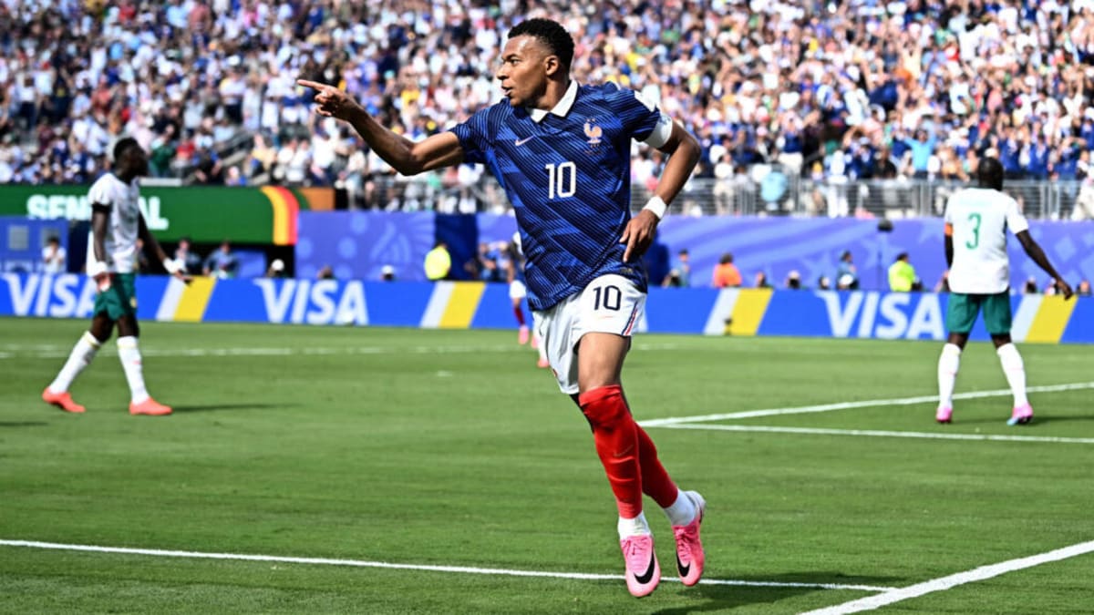 Mbappé Scores Twice as France Advances Through Storm Delay - Image 3