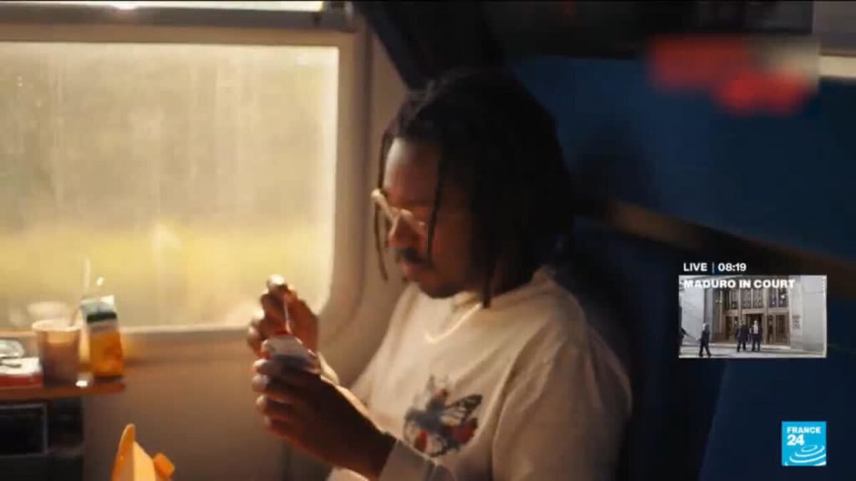 Sleeper train at platform at night with passengers boarding between Paris and Berlin