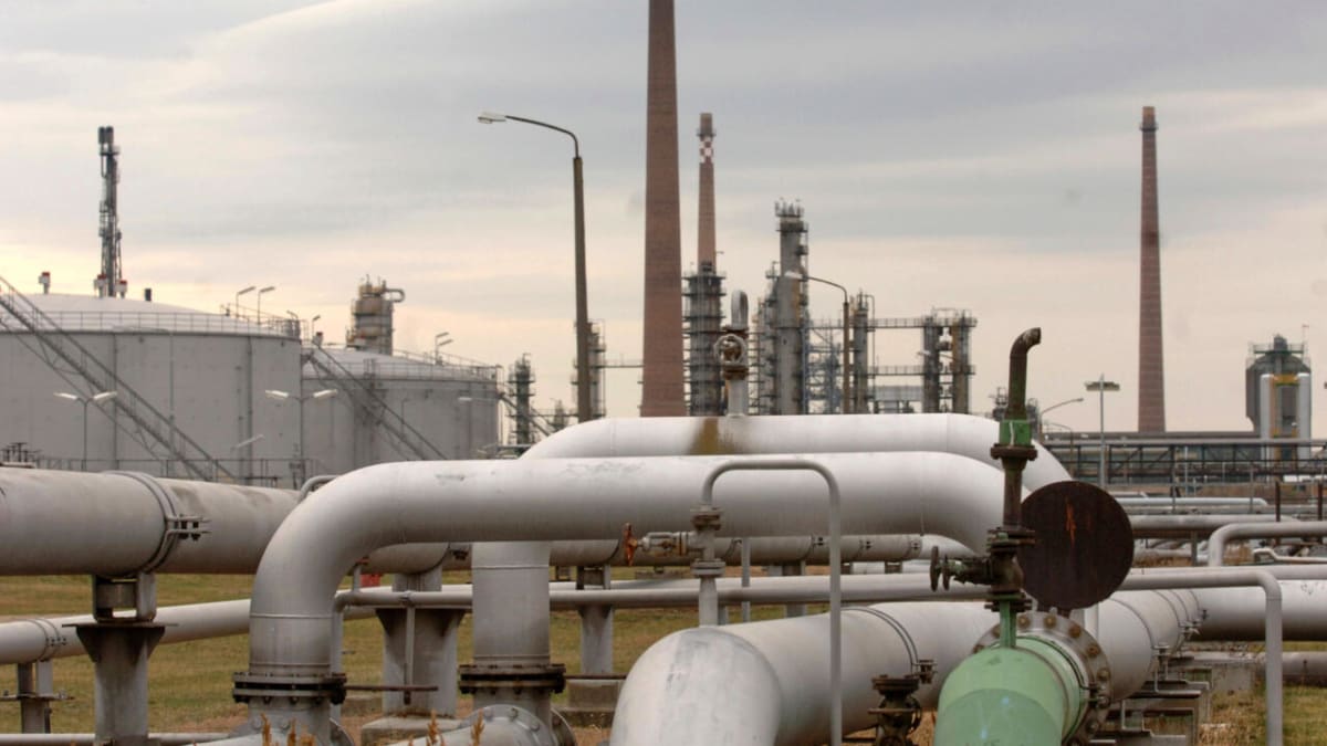 Industrial oil pipeline infrastructure with pumping station equipment and metal framework