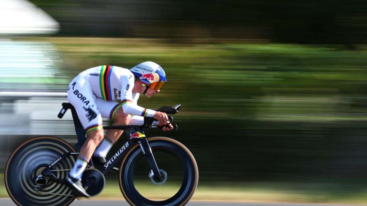 Belgian cyclist Remco Evenepoel racing during Tour de France time trial along Lake Geneva
