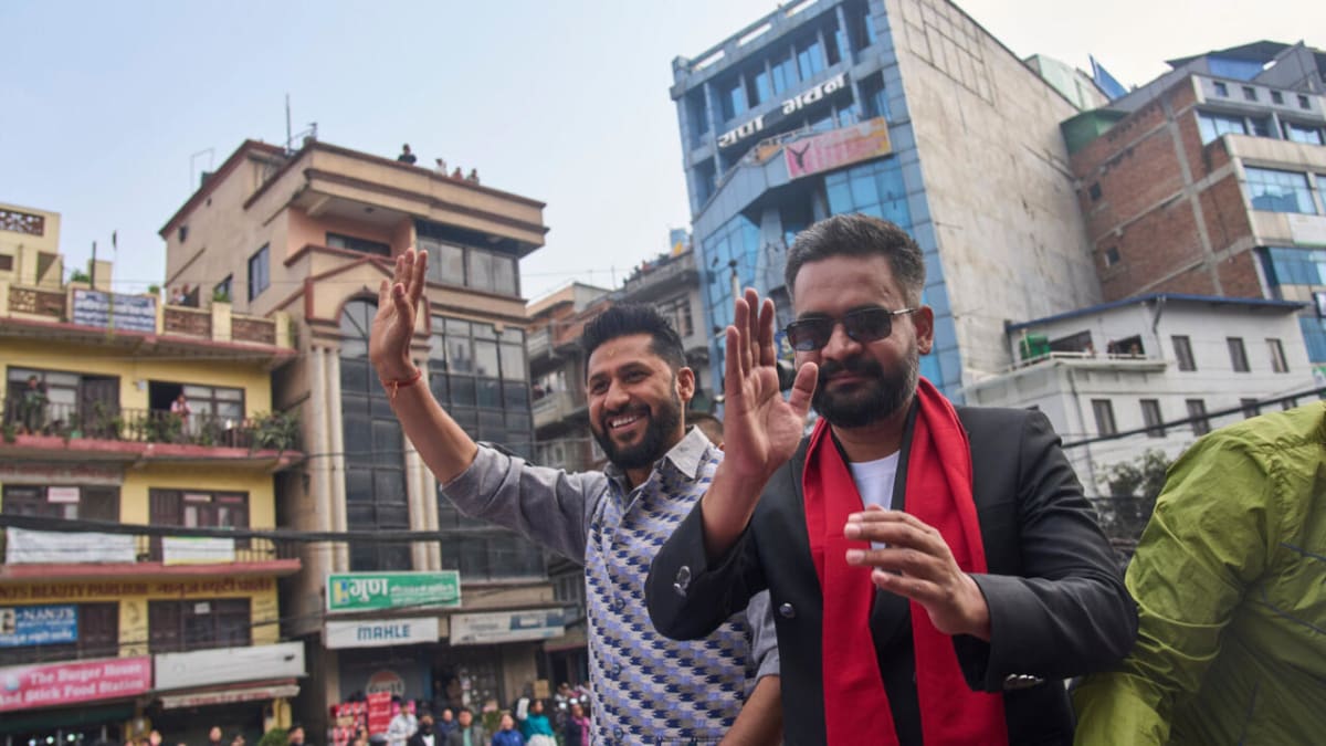 Young politician Balendra Shah waves to supporters during campaign rally in Nepal