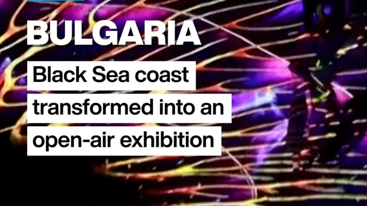 Digital light art projection illuminating Bulgaria's Black Sea coastal landscape at night during festival