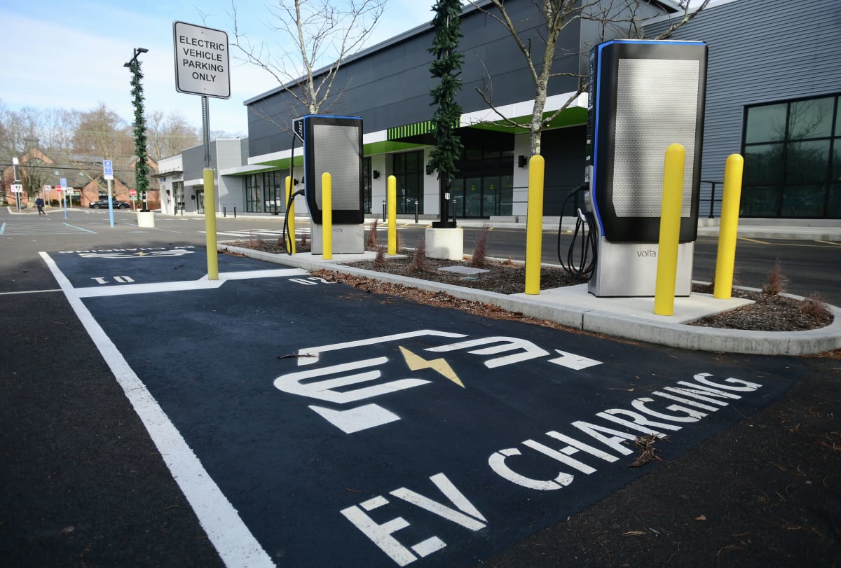 Electric vehicle charging at a Connecticut state government parking facility with multiple charging ports