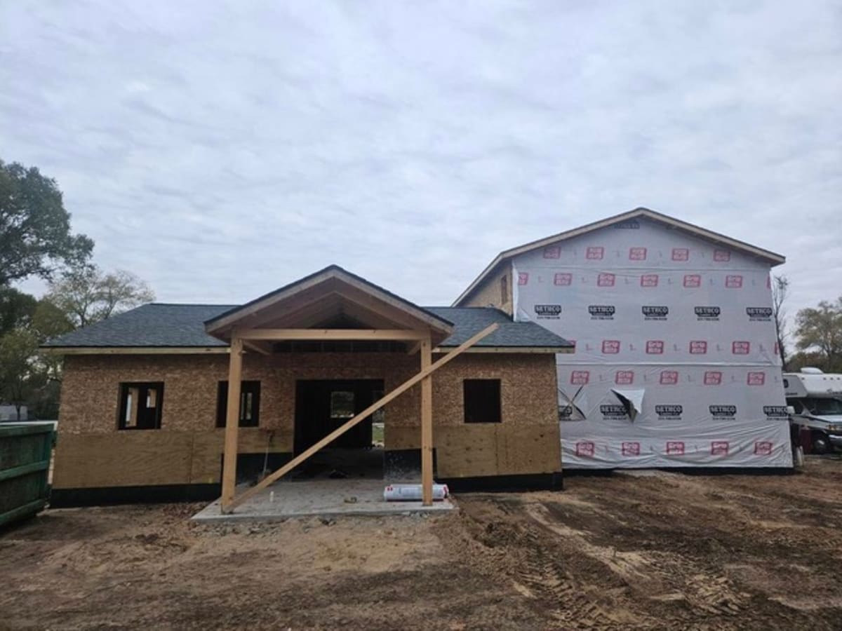 Horizon Bank volunteers working alongside Habitat for Humanity construction team on home build