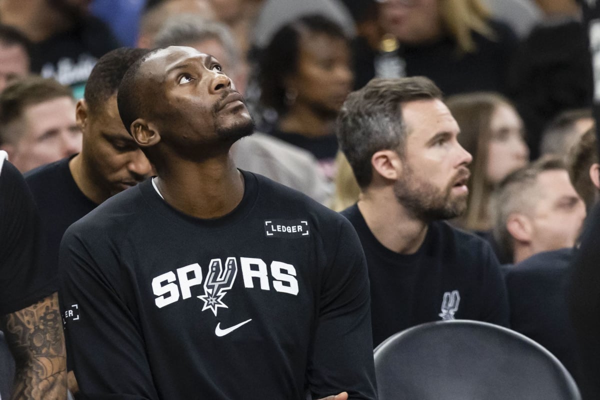San Antonio Spurs center Bismack Biyombo smiling at charity gala with teammates