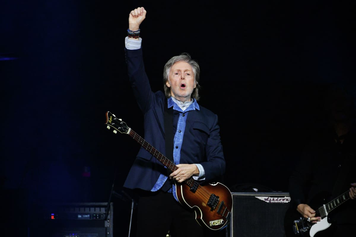 Paul McCartney performing on rainbow-lit stage at Apple Park headquarters in Cupertino, California