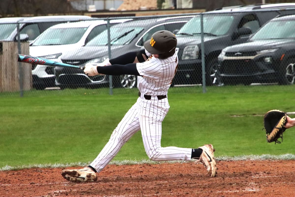 ** Bay City Western baseball player Jimmey Sequin batting during championship series game against Flint Powers