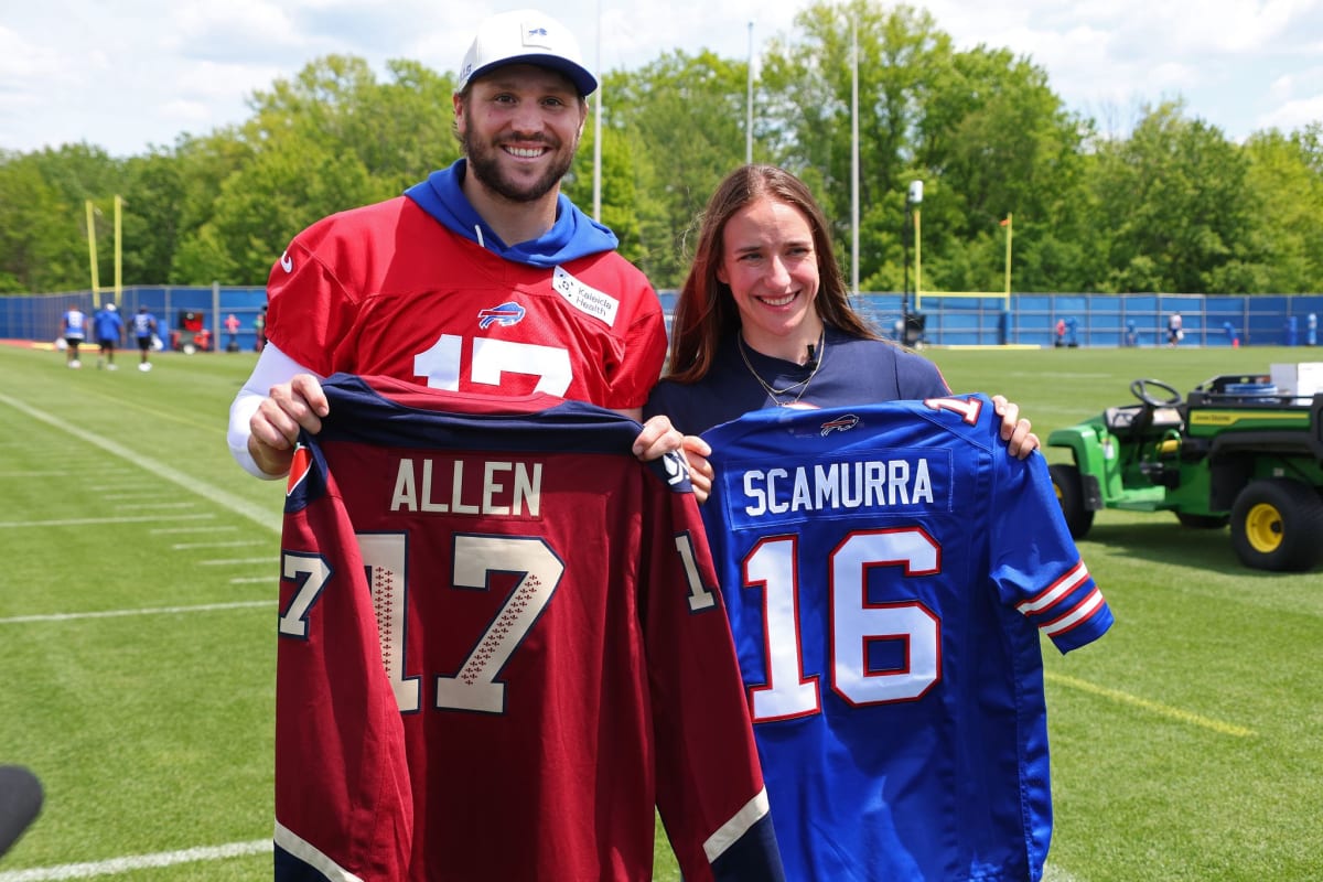 Buffalo Bills quarterback Josh Allen poses with Olympic hockey gold medalist Hayley Scamurra at practice